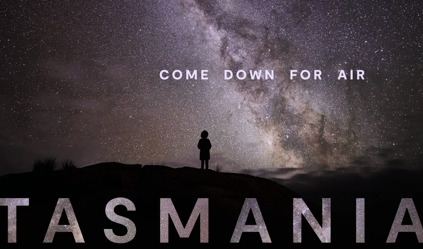 Tasmania Come Down For Air brand image showing a person silhouetted on a hilltop beneath the Milky Way in a night sky