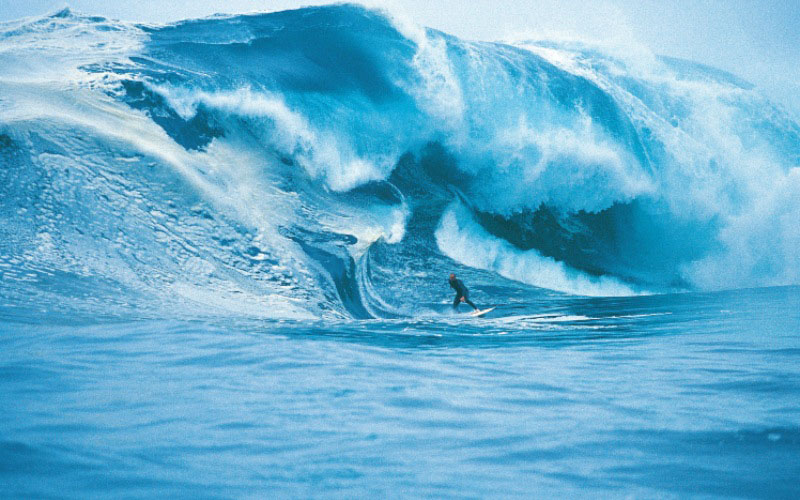 A lone surfer rides down a 10 metre wave at Shipstern Bluff, Tasmania